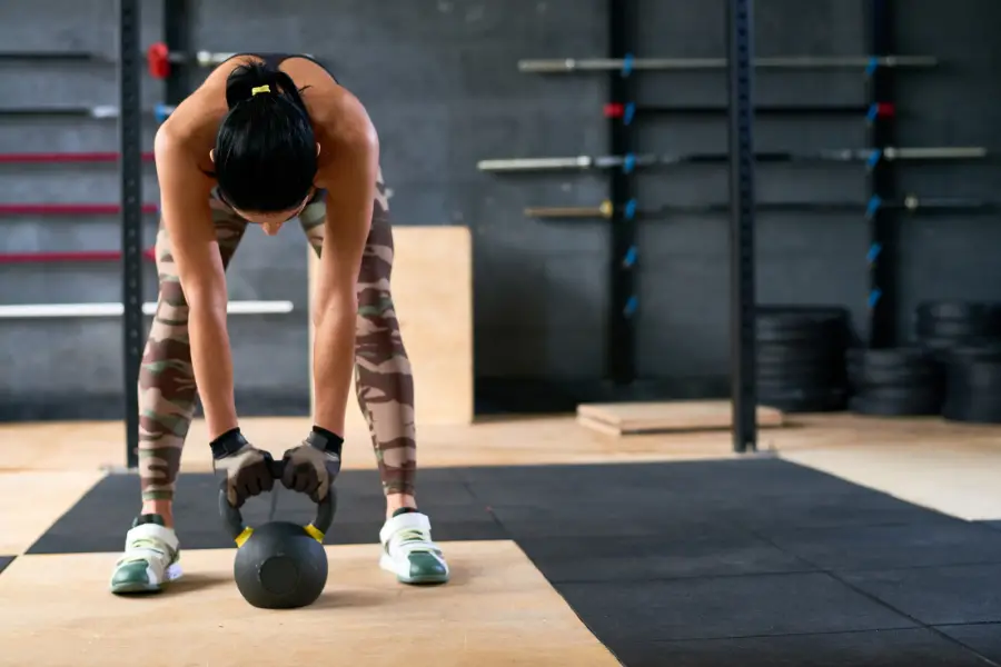 Image of a woman using a kettlebell